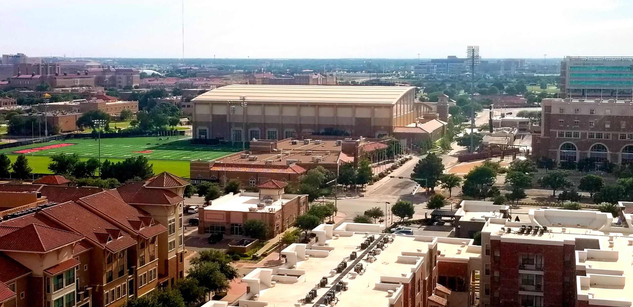 Aerial view of university campus with athletic fields.